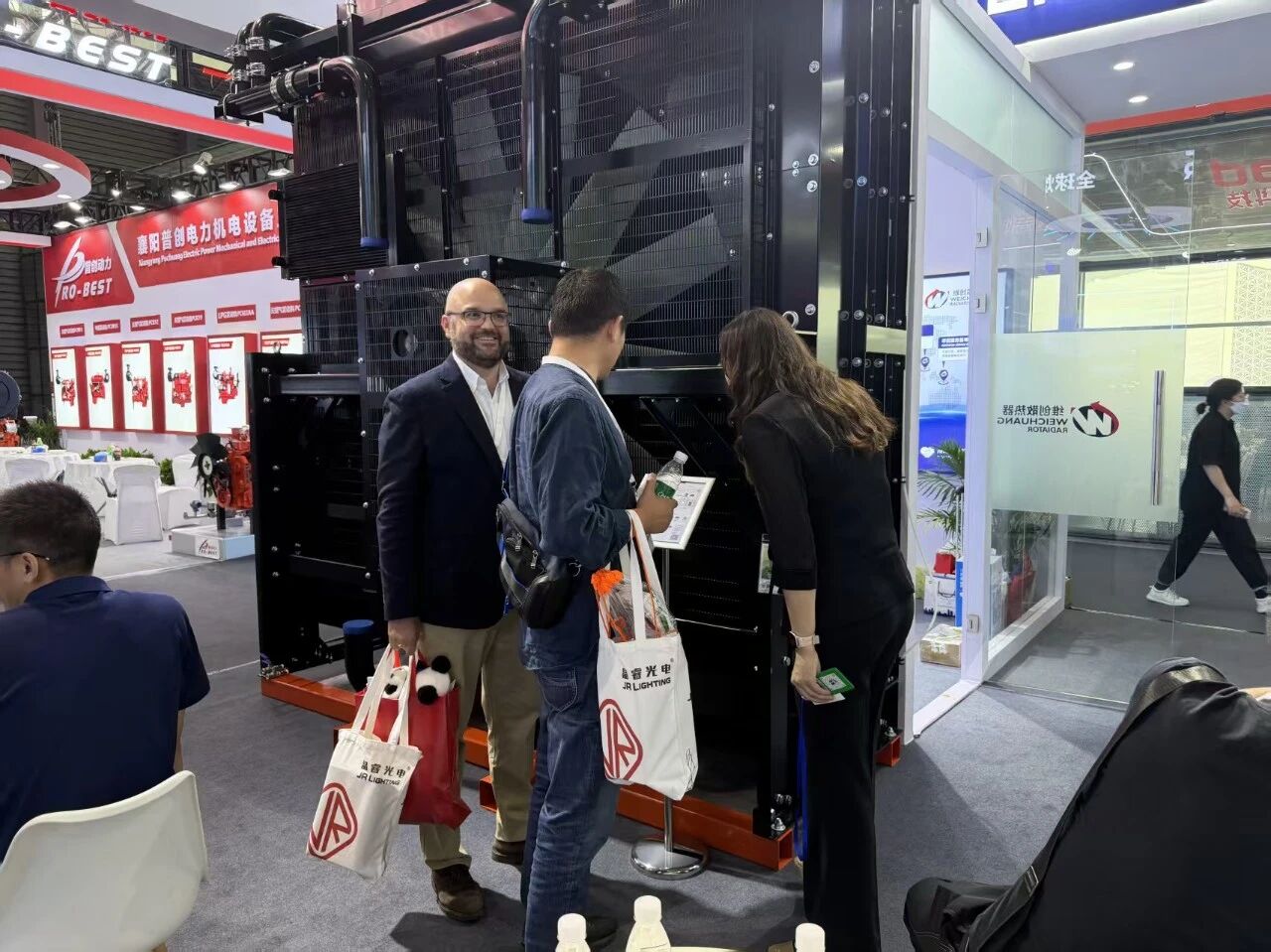 Weichuang staff explaining radiator products to customers